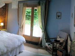 Chalet Ambroise - (fr)Bedroom 1, showing french windows to garden