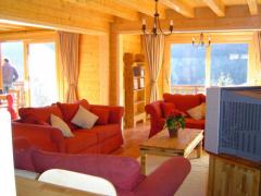 Chalet Chamois - (fr)The living room with doors to balcony