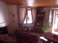 Chalet La Chapeline - (fr)The living area and fireplace