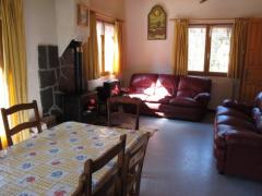 Chalet Le Chargeau - (fr)The living room with log burner