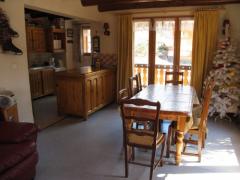 Chalet Le Chargeau - (fr)Dining area with doors to balcony