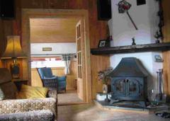 Chalet Les Chouettes - (fr)Log burner in the dining room