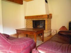 Chalet Frevuard - (fr)Sitting area and fireplace