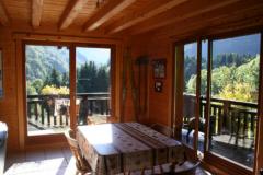 Chalet La Perriere - (fr)Dining area with doors to balcony